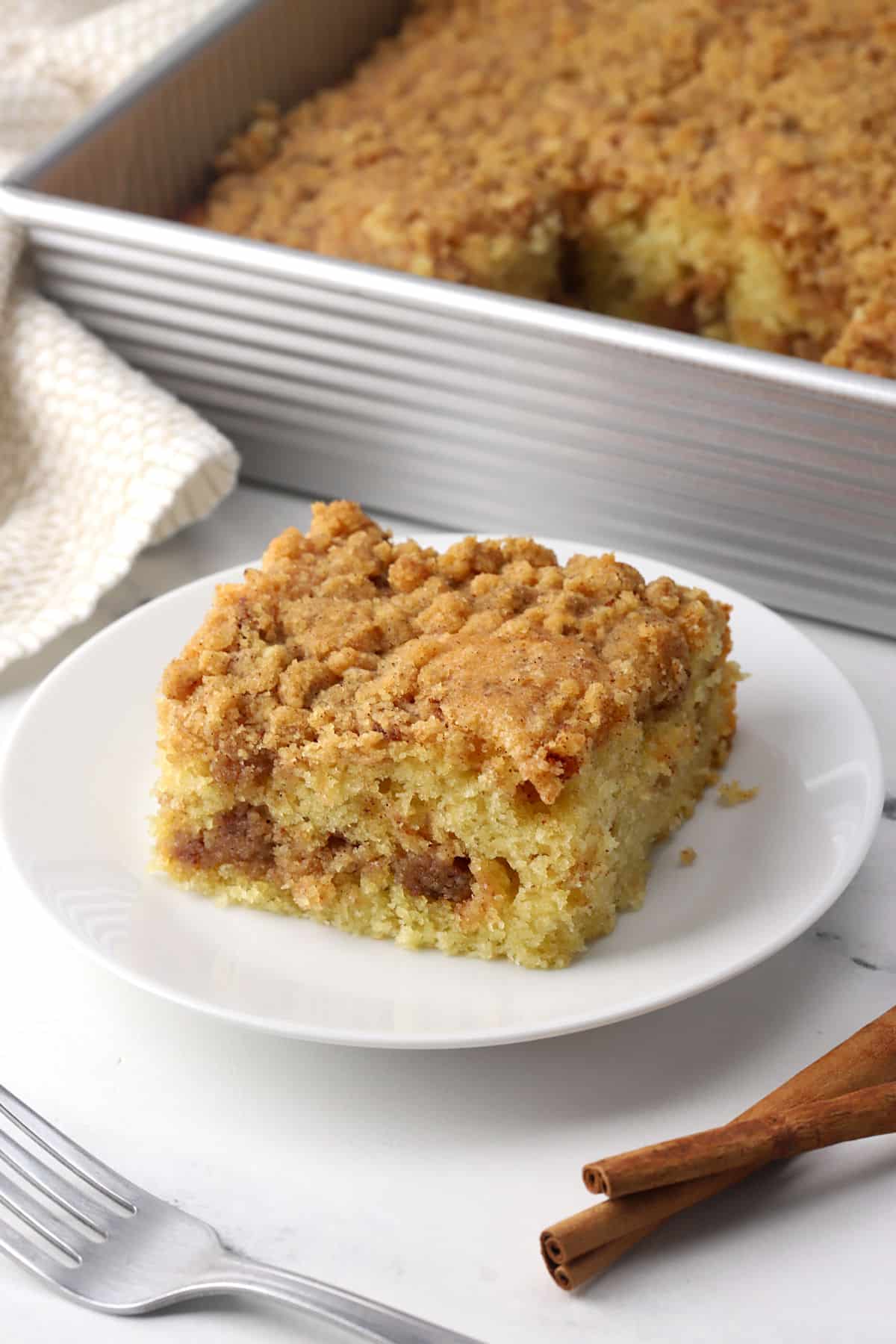 A square of coffee cake on a plate.