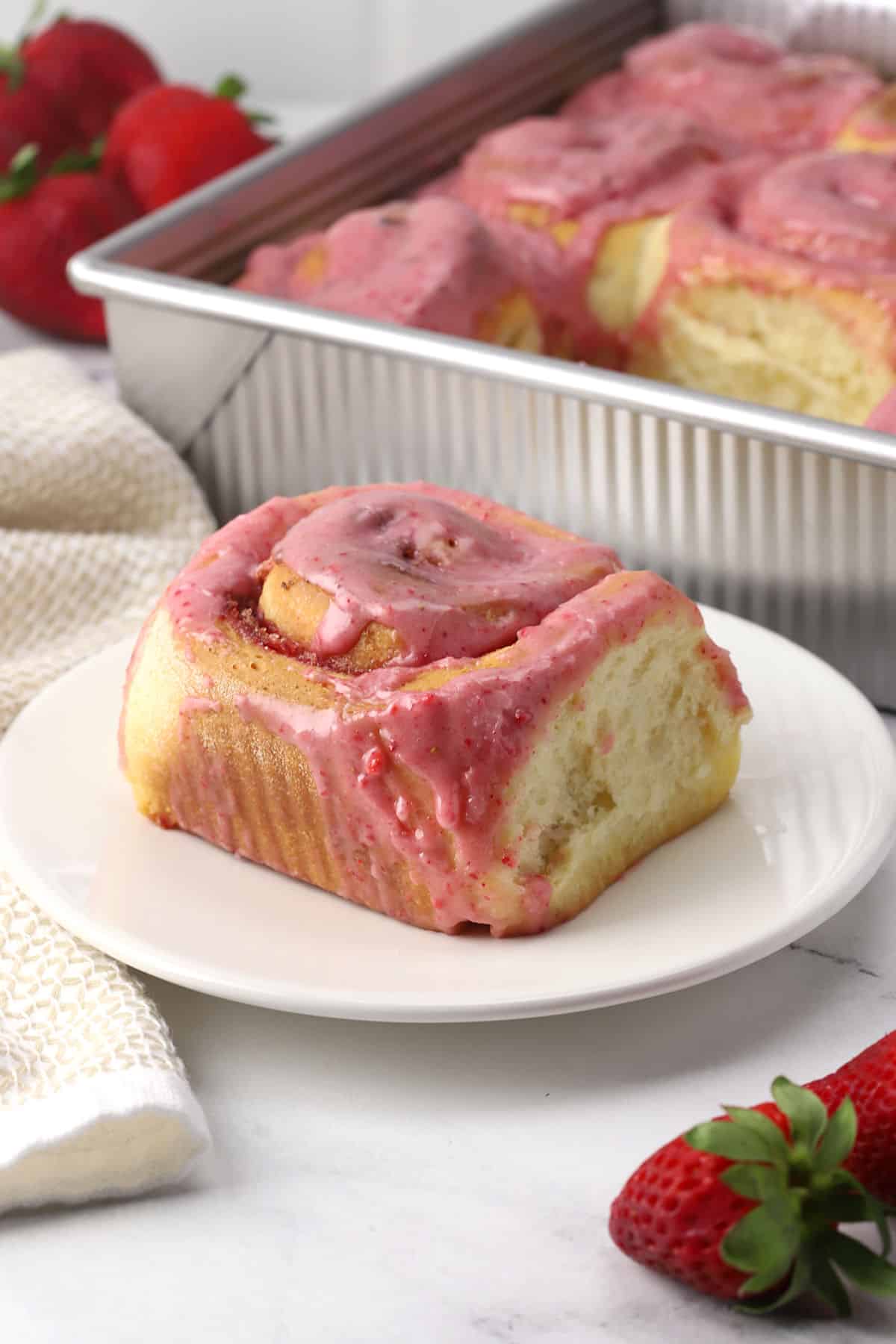A sweet roll on a plate.