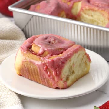 A sweet roll on a plate.