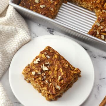 A square of pumpkin baked oatmeal on a plate.