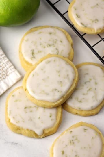 Lime shortbread cookies on a marble counter top.