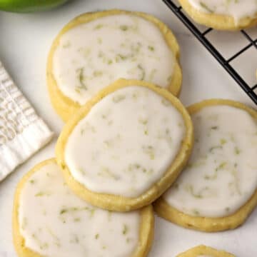 Lime shortbread cookies on a marble counter top.