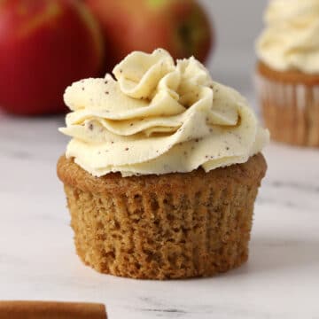 An unwrapped and frosted cupcake.