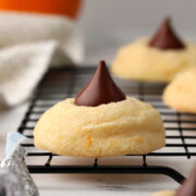 Orange blossom cookies on a cooling rack.