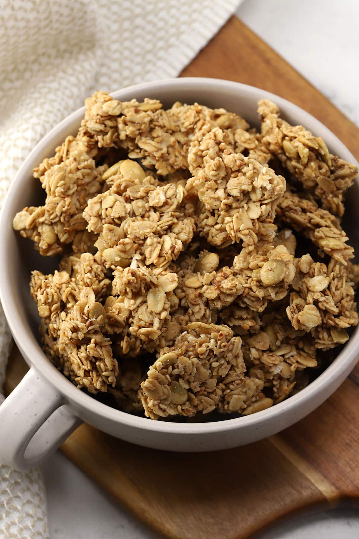 A bowl of crunchy granola pieces.