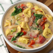 A bowl of tuscan tortellini soup.