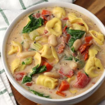 A bowl of tuscan tortellini soup.