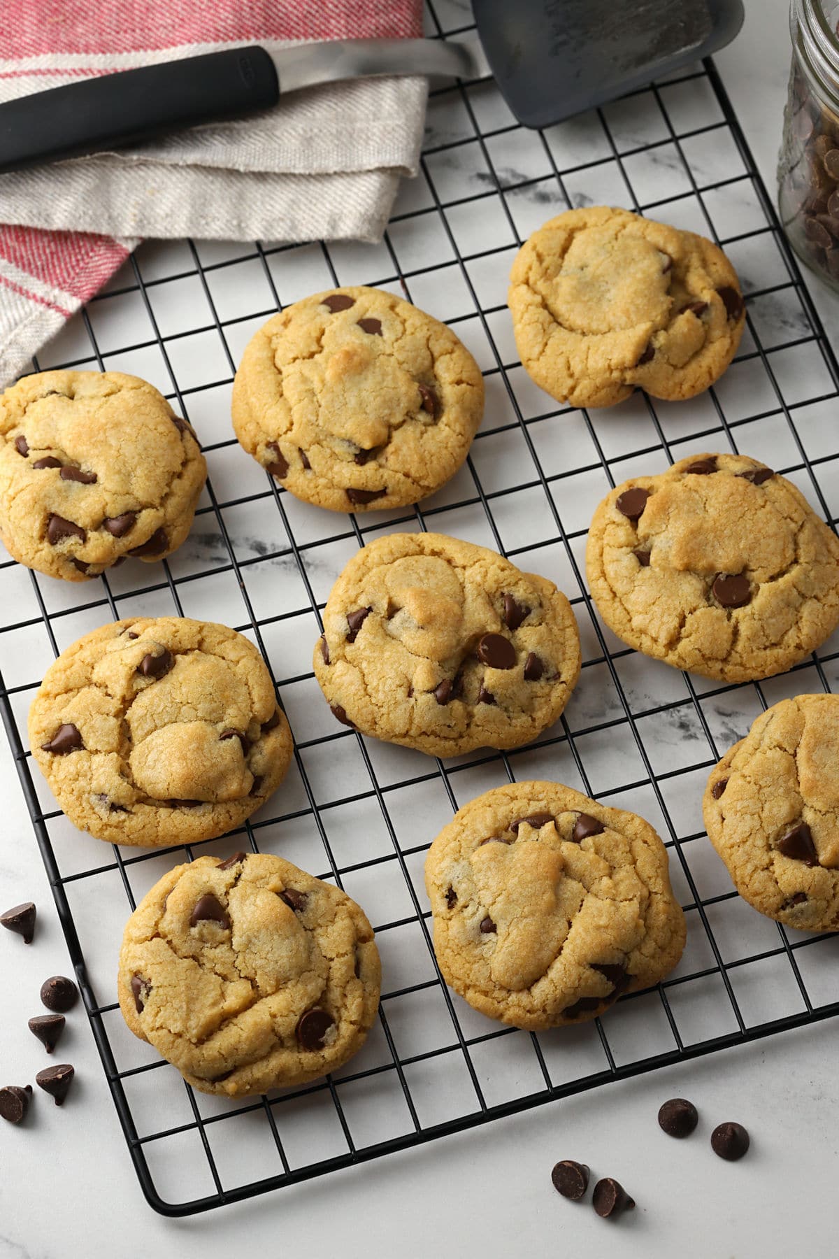 Chocolate chip cookies on a cooling rack.