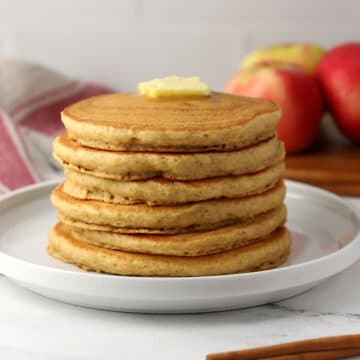 A stack of applesauce pancakes on a plate.