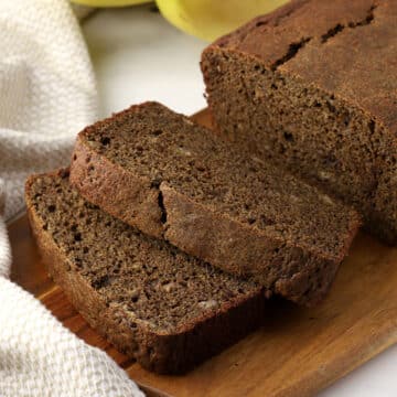 Slices of banana bread on a cutting board.