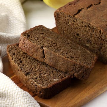 Slices of banana bread on a cutting board.