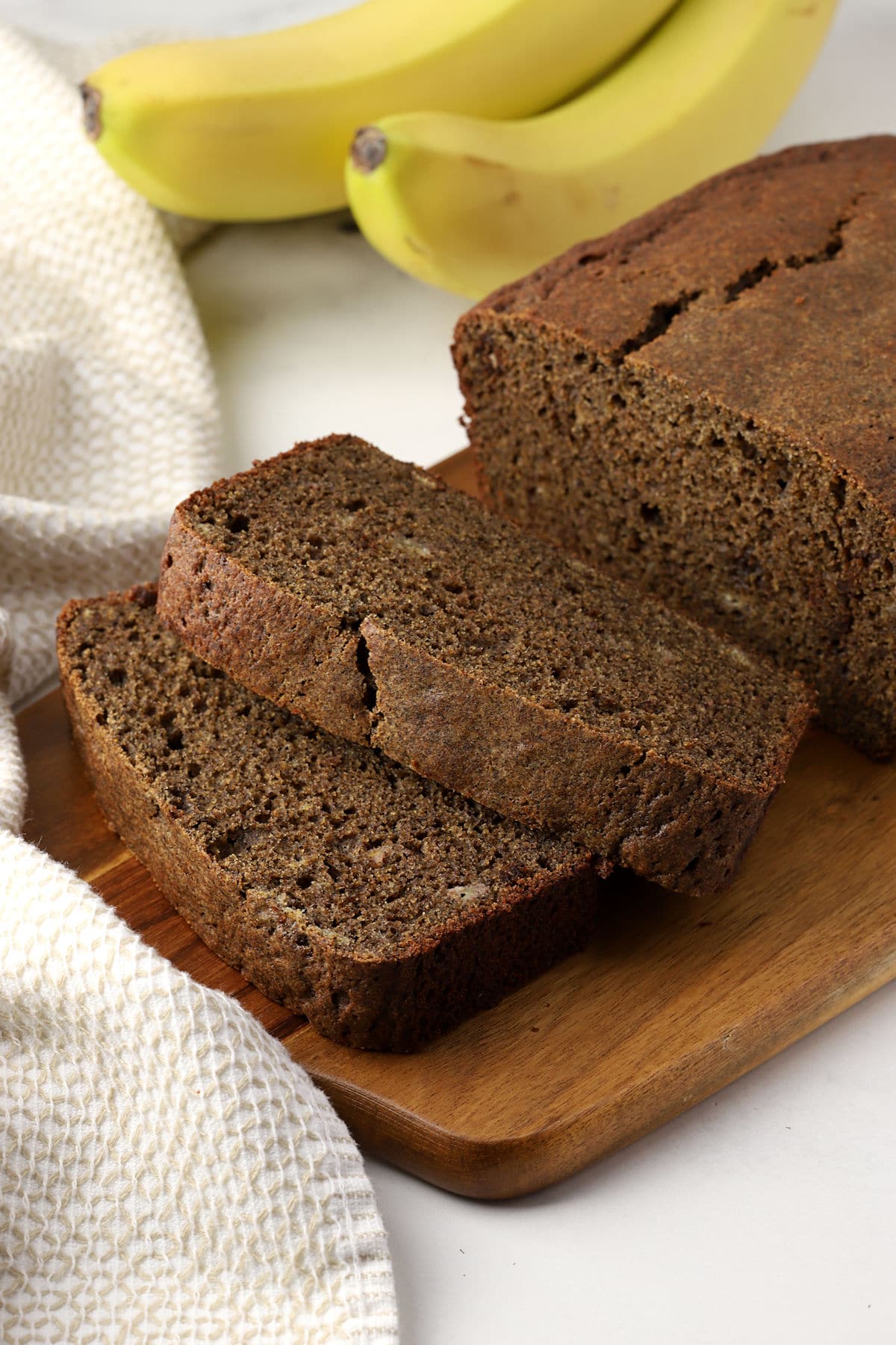 Slices of banana bread on a cutting board.