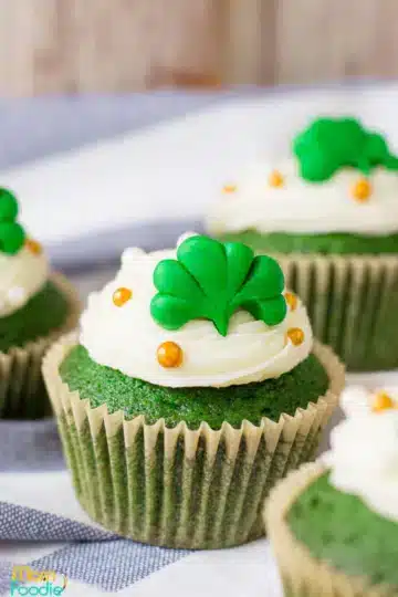 Cupcake decorated with shamrock icing.