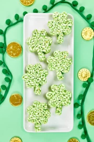 Shamrock shaped rice krispie treats on a platter.