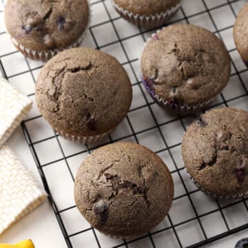 Buckwheat blueberry muffins on a cooling rack.