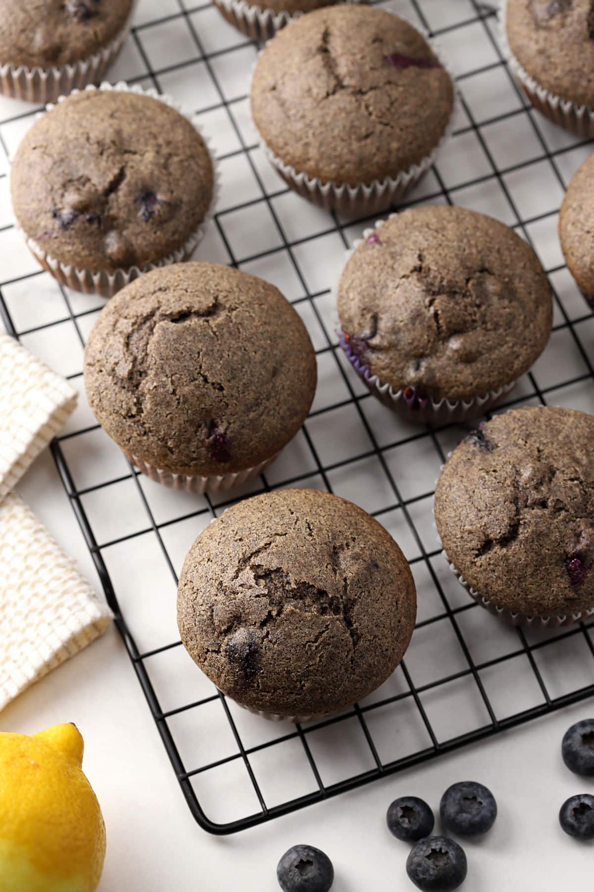 Buckwheat blueberry muffins on a cooling rack.