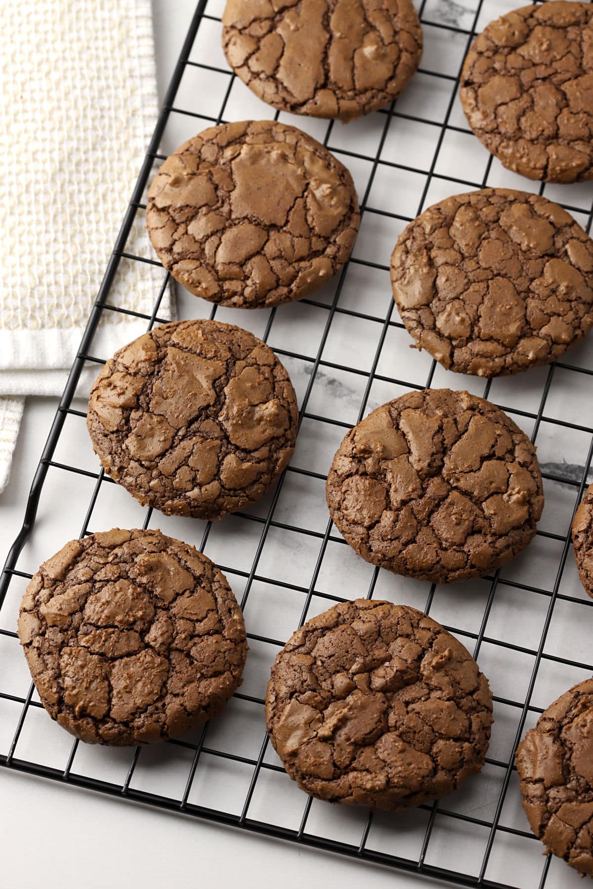 Buckwheat brownie cookies on a cooling rack.
