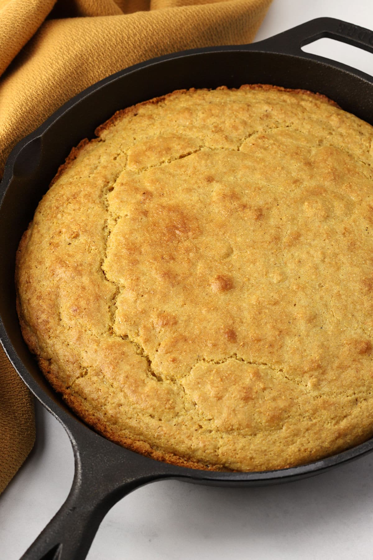 A cast iron pan of cornbread.