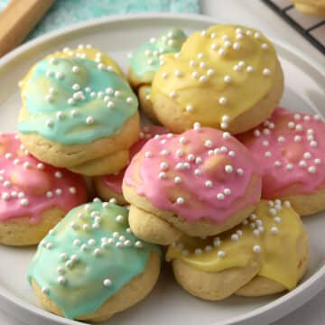 A stack of cookies on a plate.