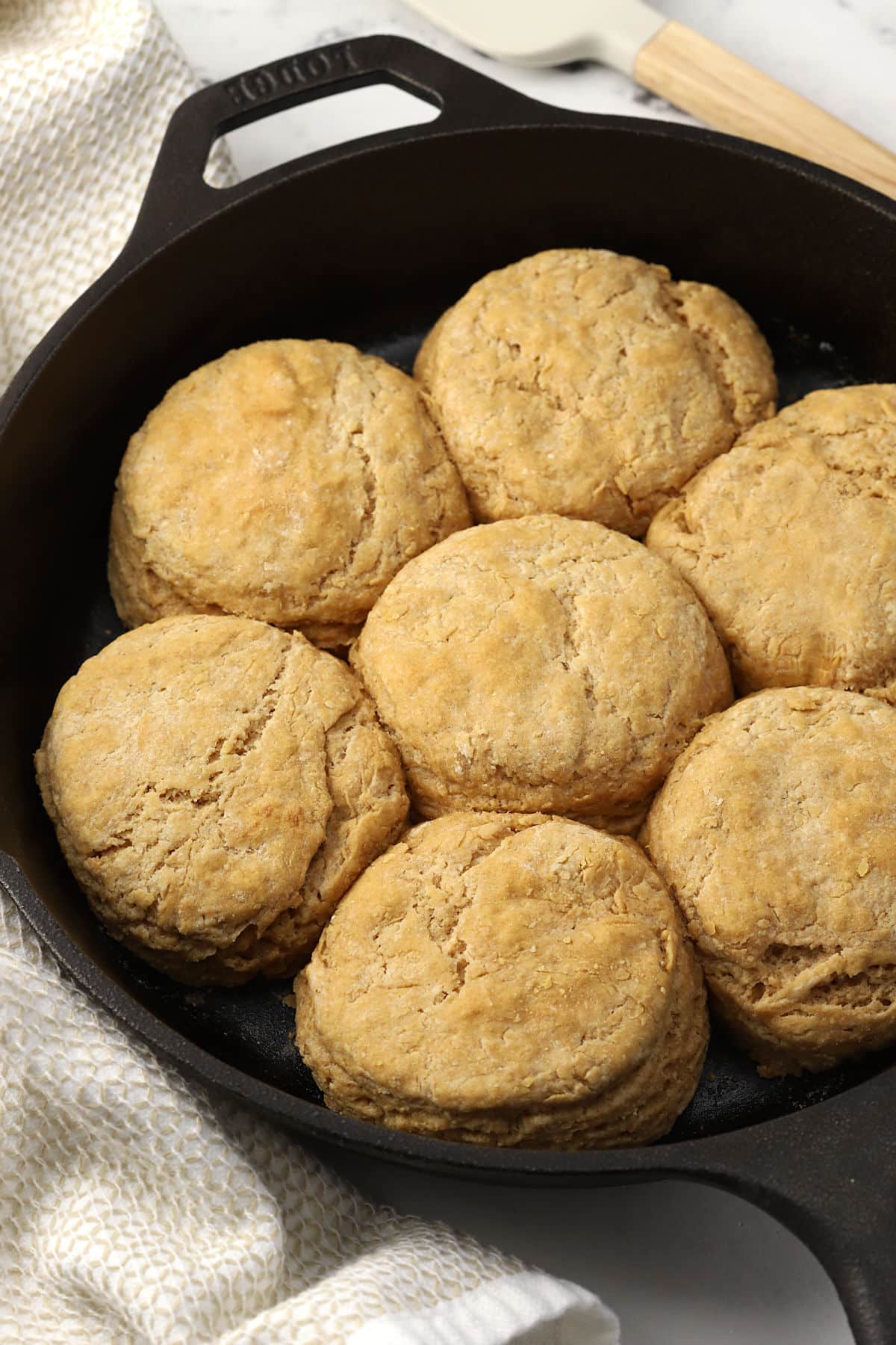 A cast iron pan of biscuits.