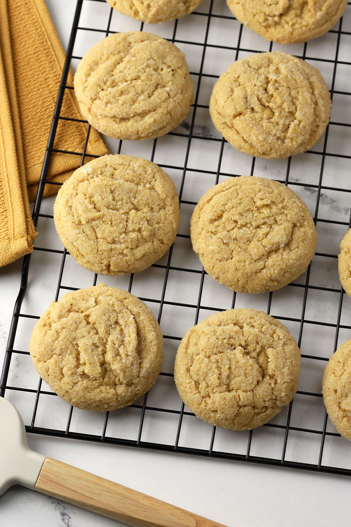 Sugar cookies on a baking rack.