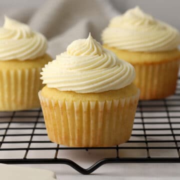 A buttermilk cupcake on a cooling rack.