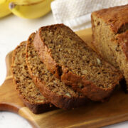 Slices of banana bread on a cutting board.
