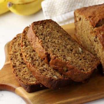 Slices of banana bread on a cutting board.