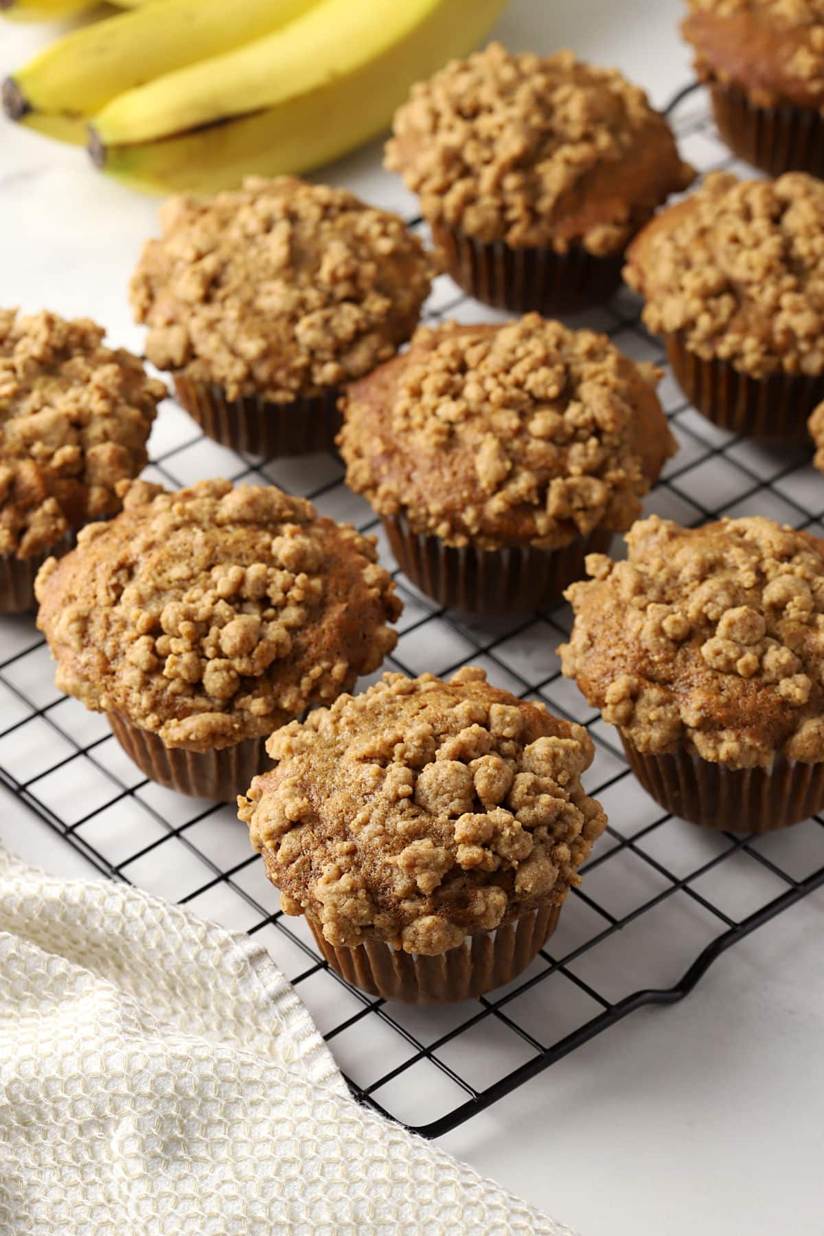 Spelt banana muffins on a cooling rack.