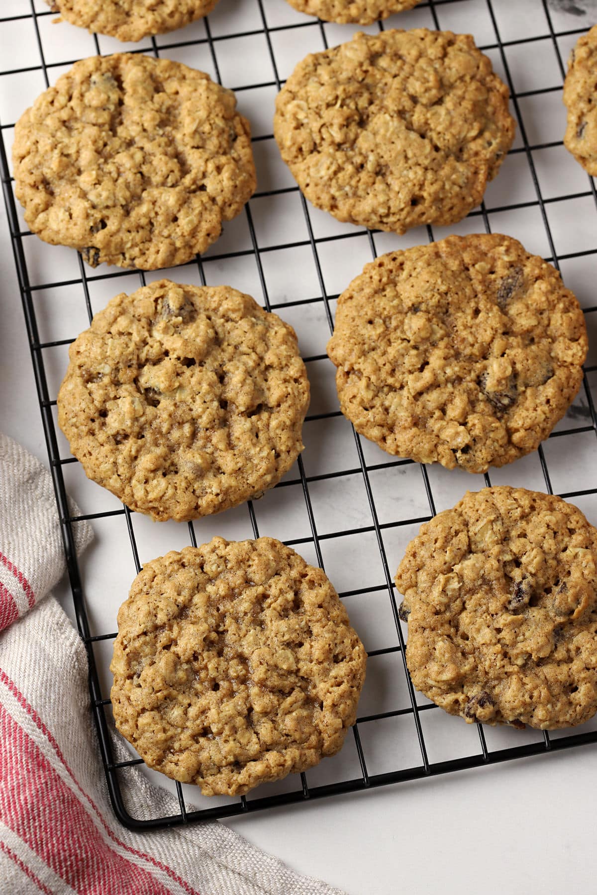 Spelt oatmeal raisin cookies on a cooling rack.