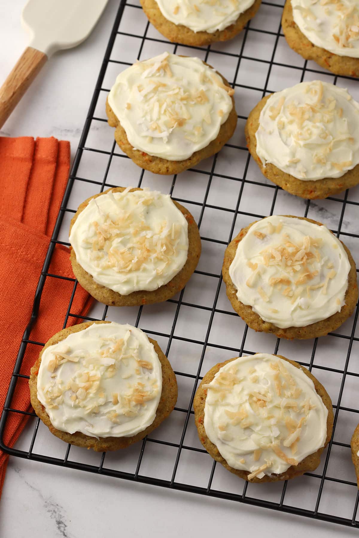 Carrot cake cookies on a cooling rack.