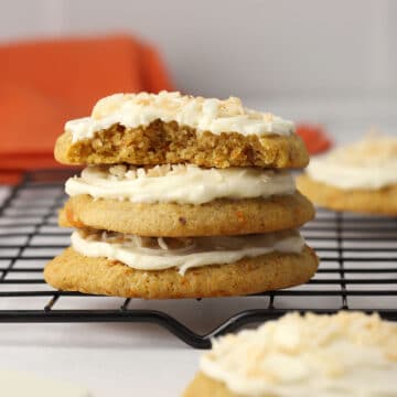 Stack of carrot cake cookies on a cooling rack.