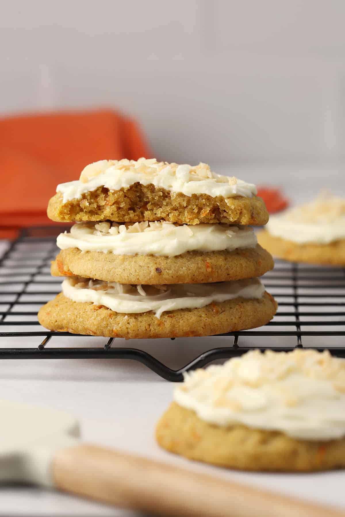 Stack of carrot cake cookies on a cooling rack.