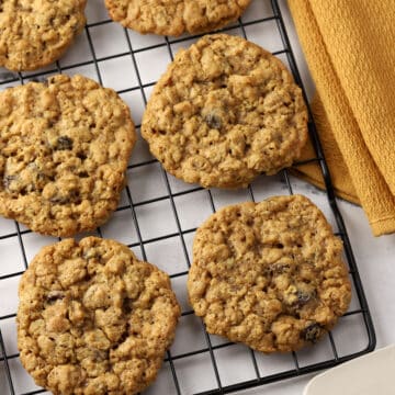 Oatmeal cookies cooling on a rack.