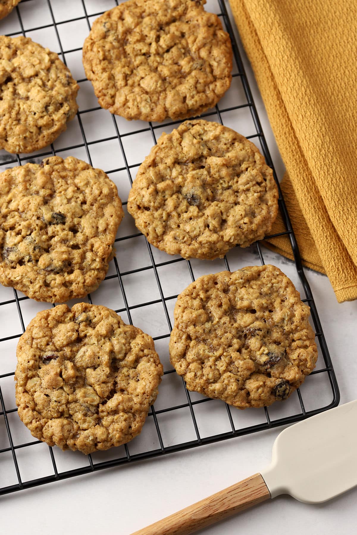 Oatmeal cookies cooling on a rack.
