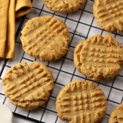 Peanut butter cookies on a cooling rack.