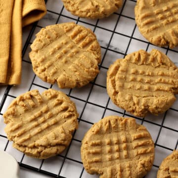 Peanut butter cookies on a cooling rack.