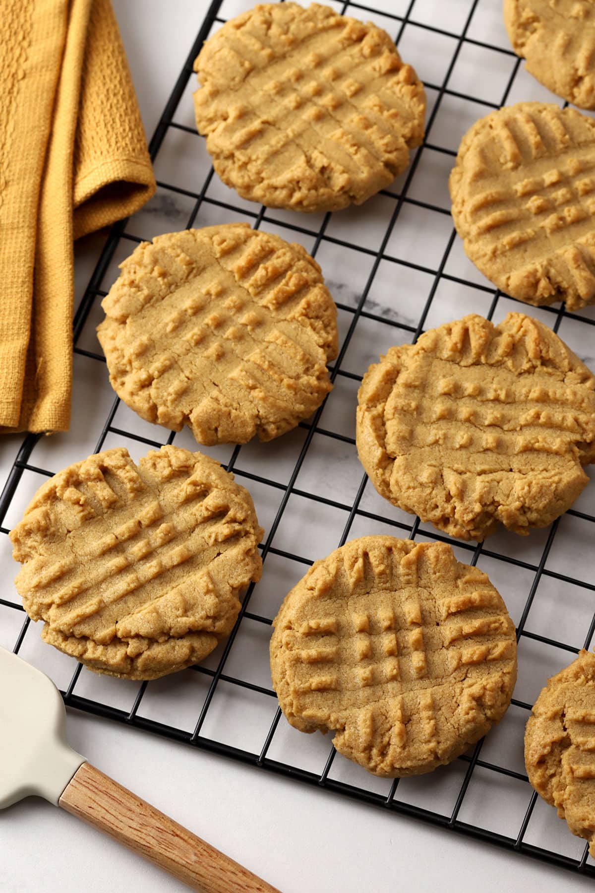 Peanut butter cookies on a cooling rack.