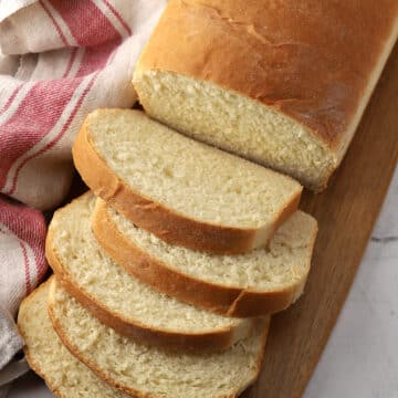 Slices of sandwich bread on a cutting board.