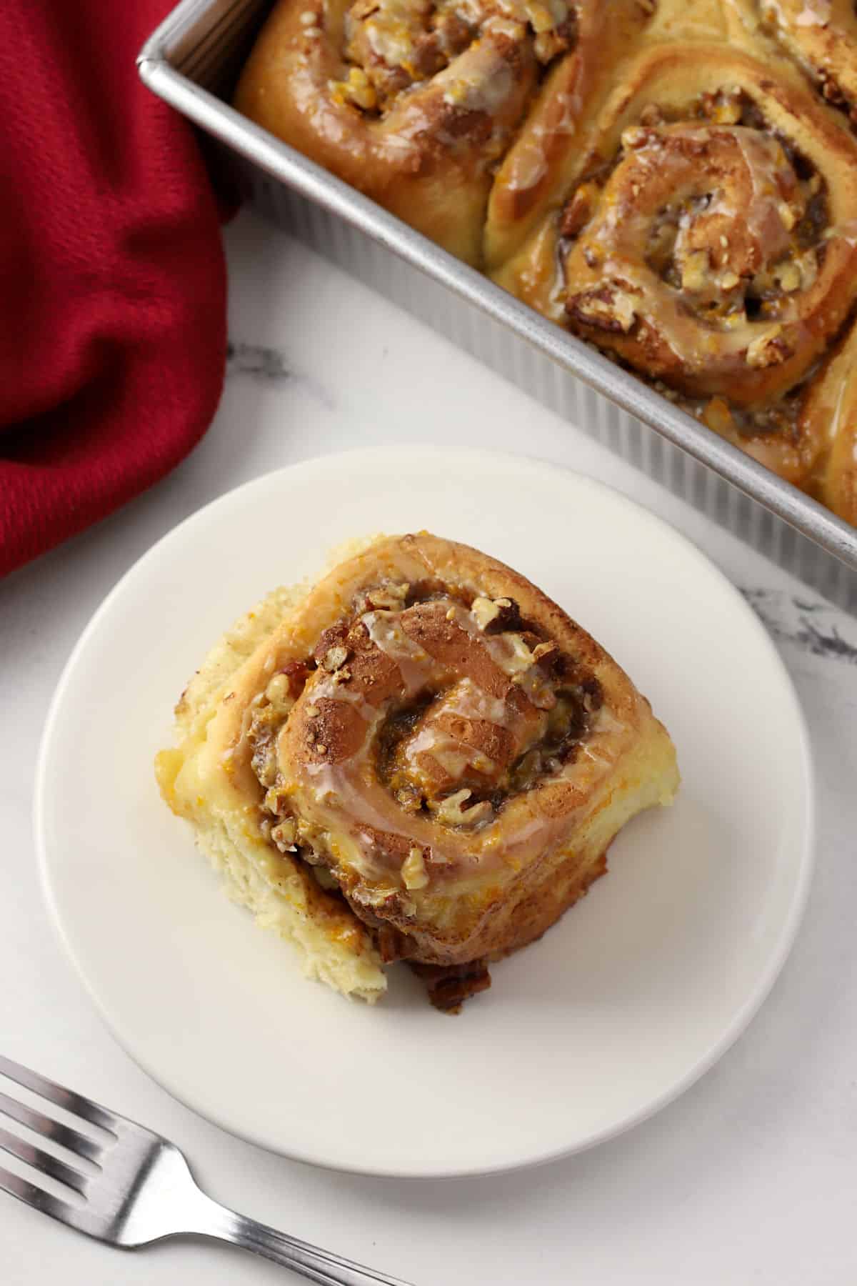 A cinnamon roll on a plate.