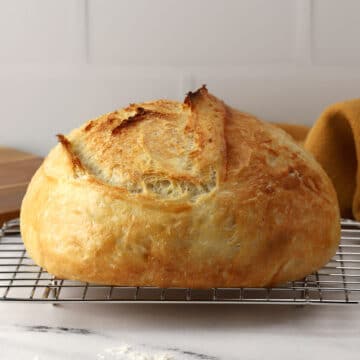 Overnight no knead bread on a cooling rack.