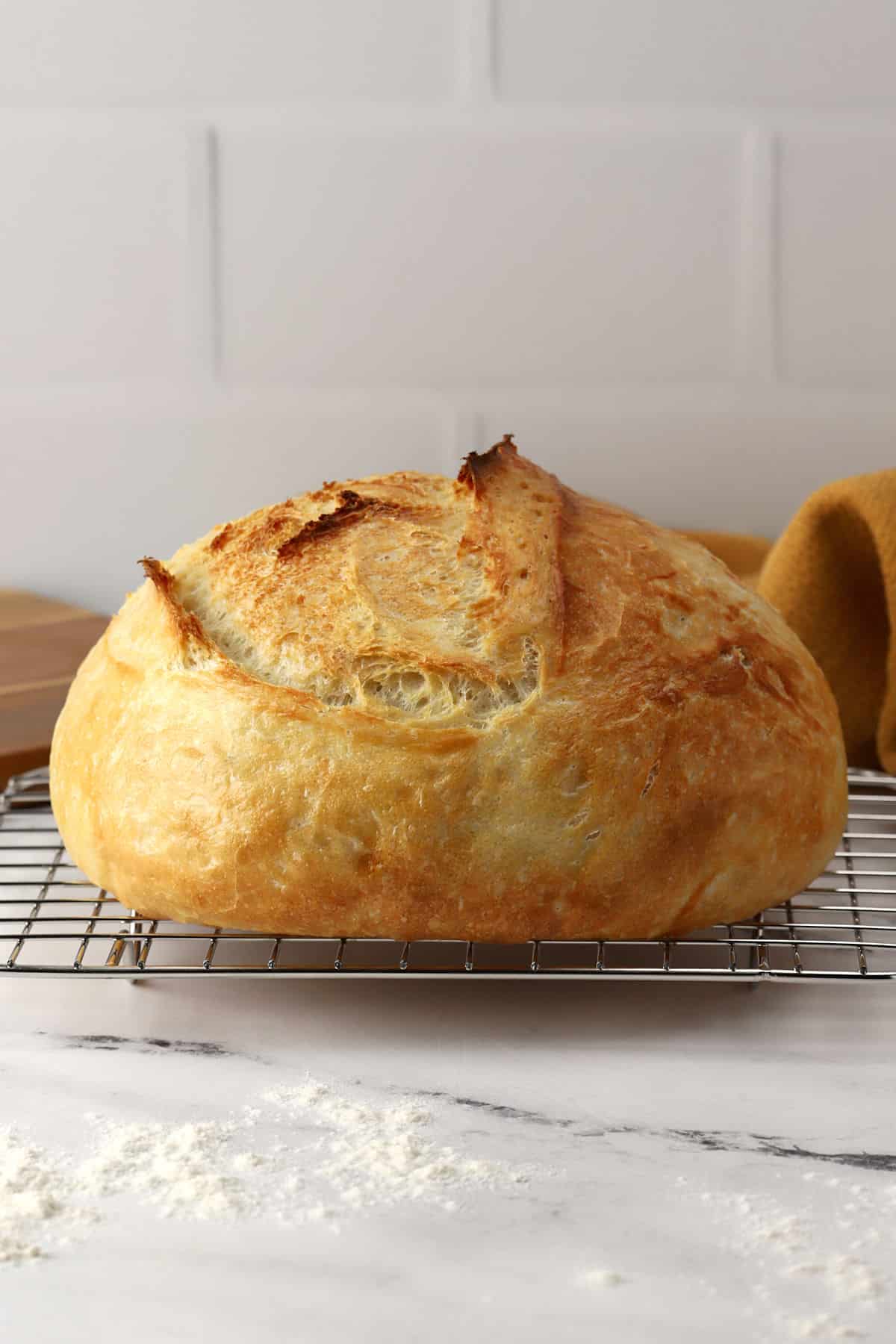 Overnight no knead bread on a cooling rack.