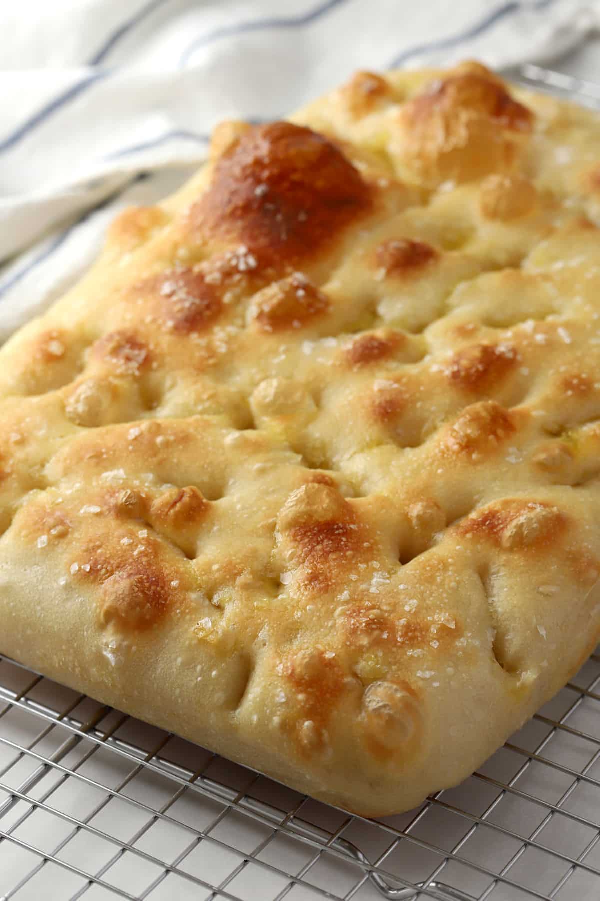 Focaccia on a cooling rack.