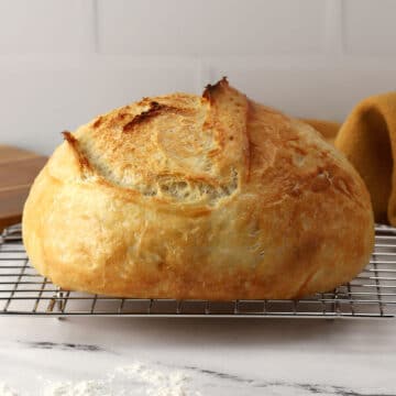 Overnight no knead bread on a cooling rack.