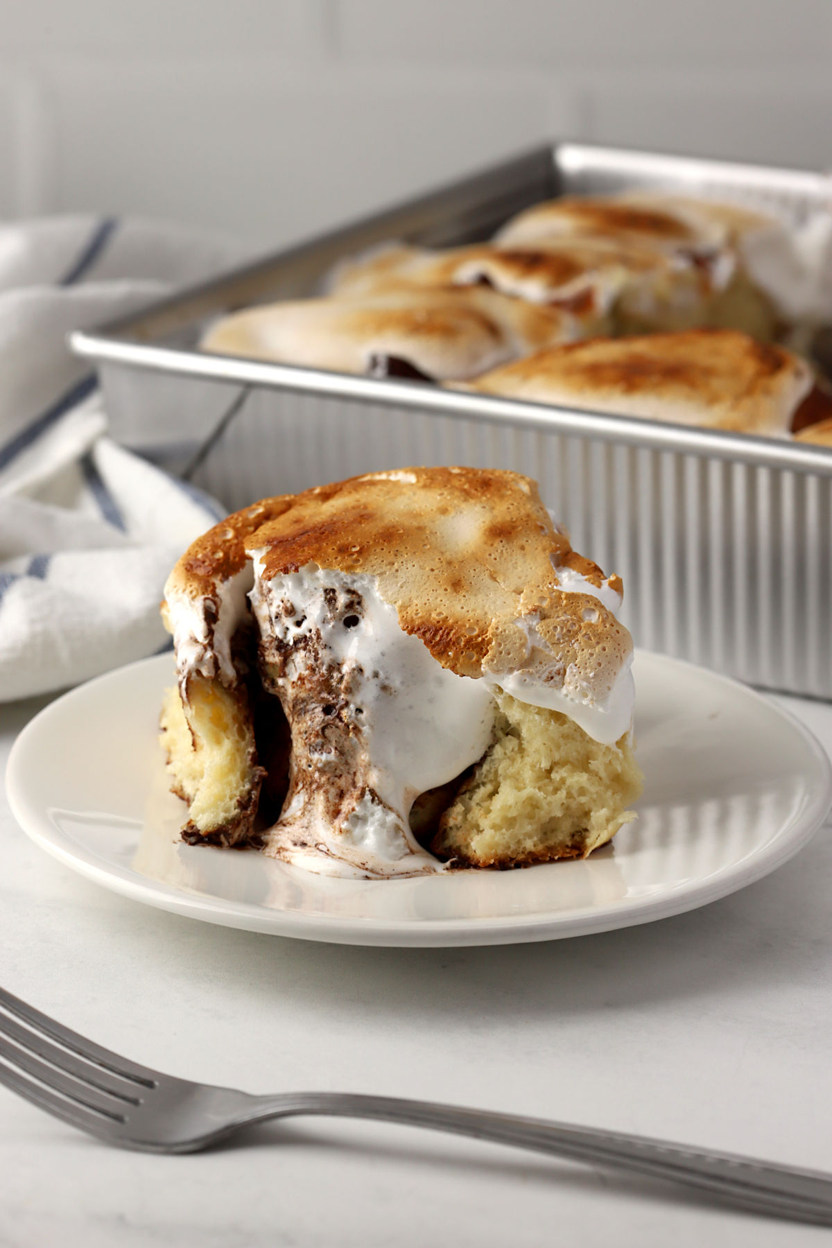 S'mores cinnamon roll on a plate.