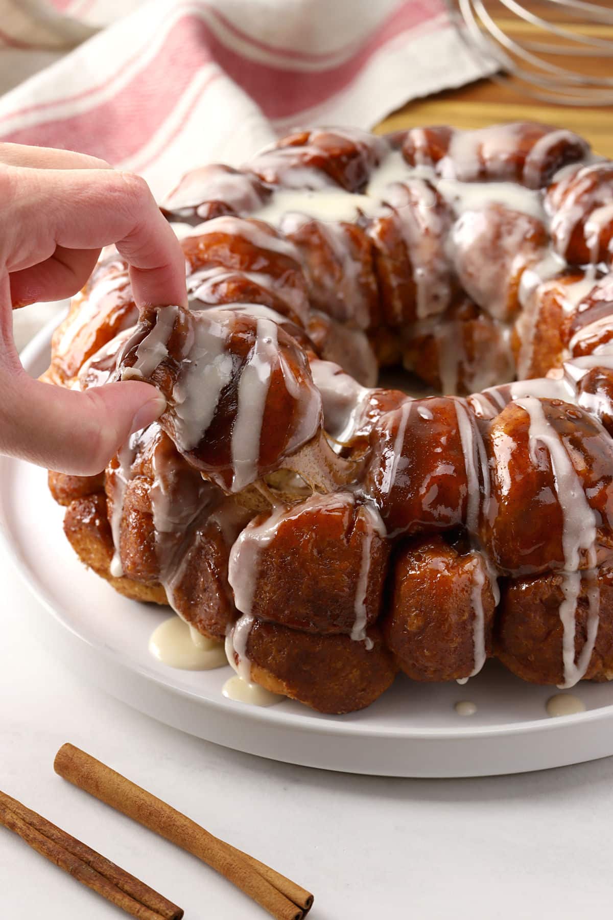 Pinching a piece of monkey bread loose.